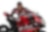 Chaz Davies, hombre blanco con pelo rubio, veste su uniforme de Ducati, una gorra y posa con su moto